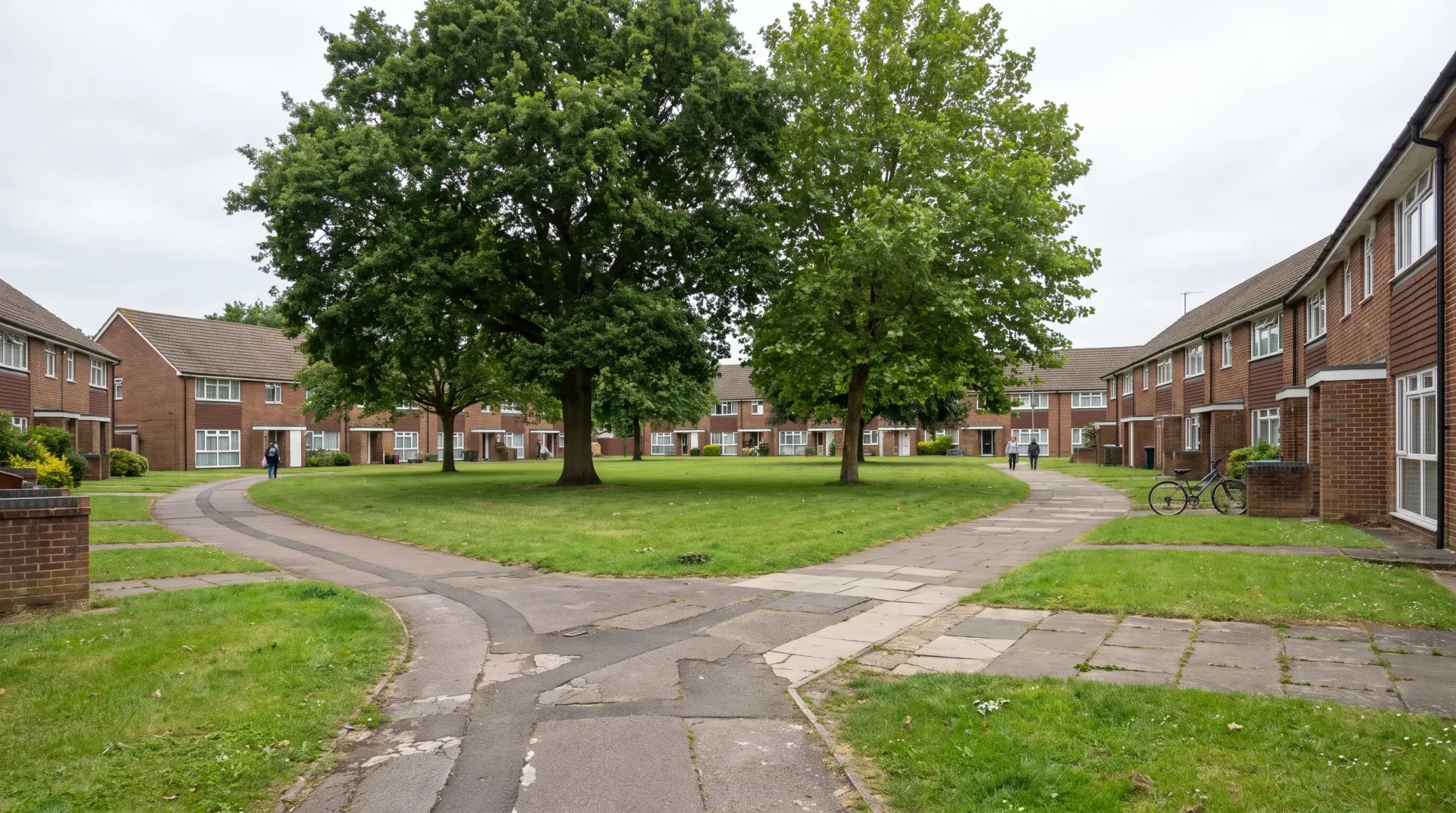 Electricians in Harlow — a street of postwar housing of the kind we work on across Harlow