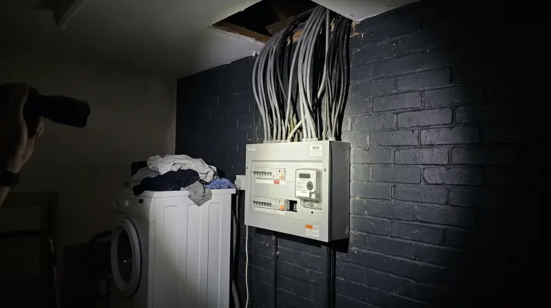 A consumer unit in the utility room of a detached house, examined on an emergency call-out in Buckhurst Hill