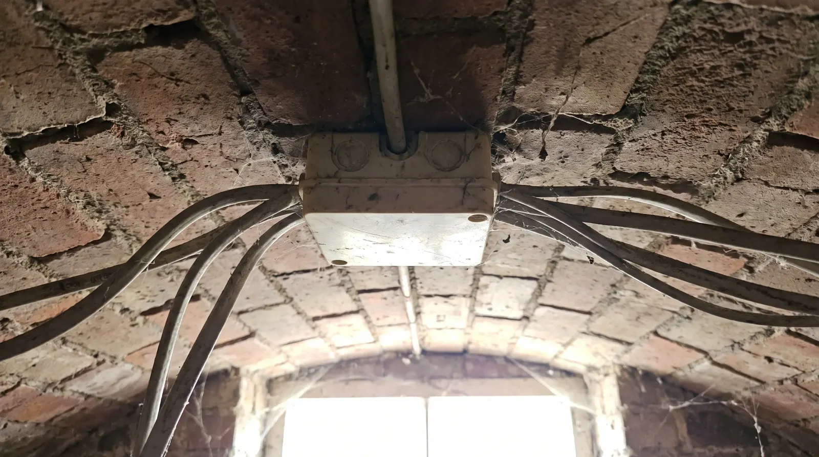 A junction box in the cellar ceiling of a terraced house — the kind of fault finding an electrician in Kentish Town is called out for