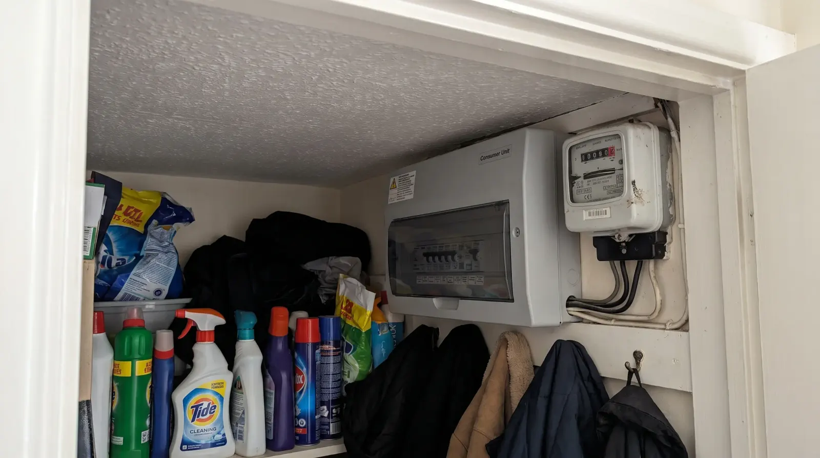 A consumer unit in the hallway cupboard of a bungalow — the kind of fuse board upgrade an electrician in Benfleet is called out for