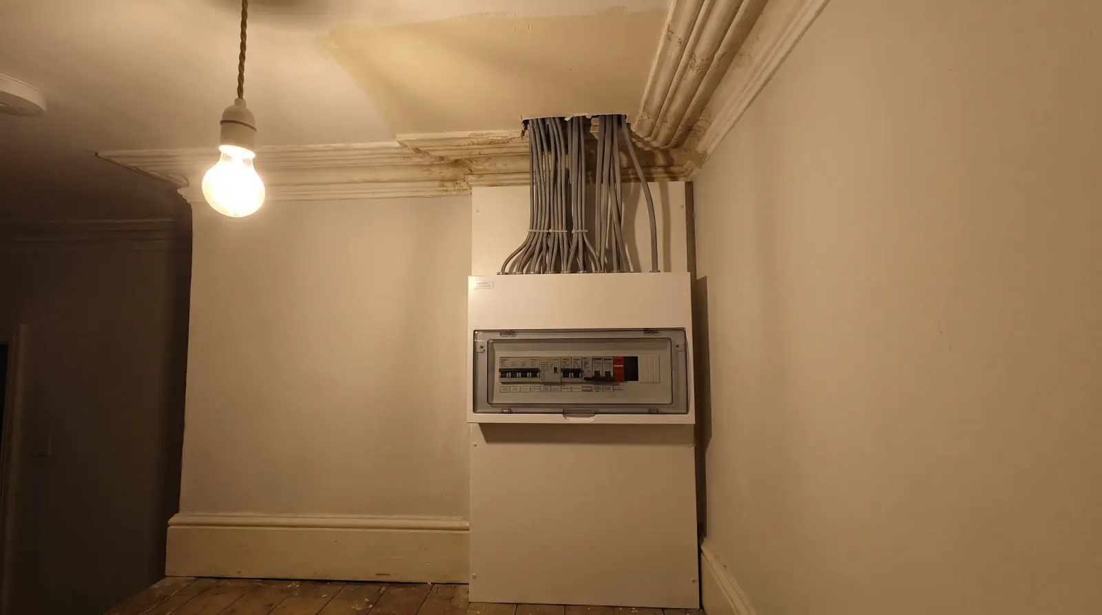 A modern consumer unit fitted in a Victorian hallway — the kind of fuse board upgrade an electrician in Wanstead is called out for