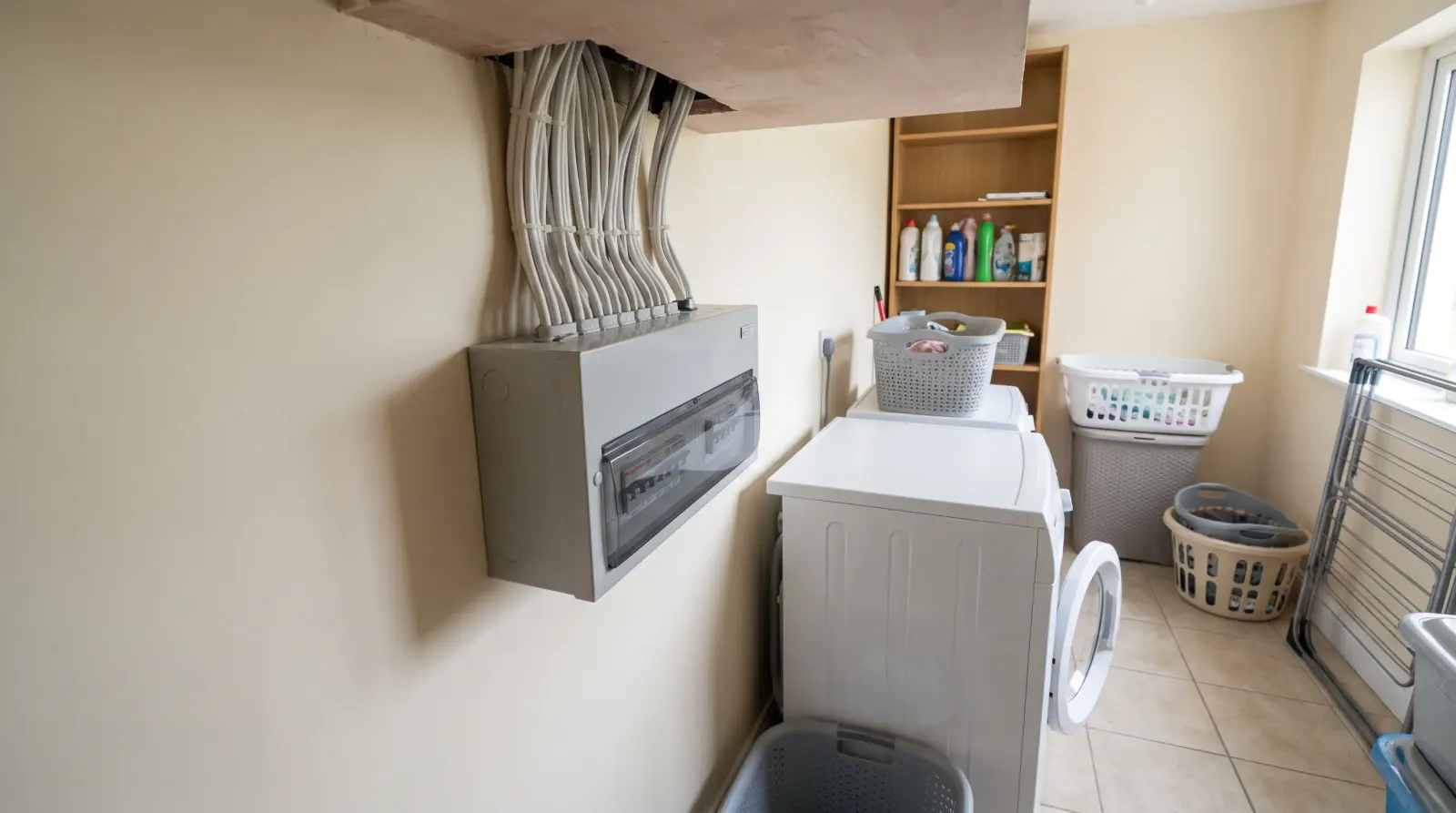 A consumer unit in the utility room of a detached house — fuse board upgrade in Upminster