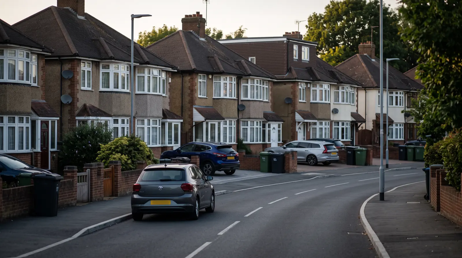 A street of 1930s semi-detached houses with bay windows