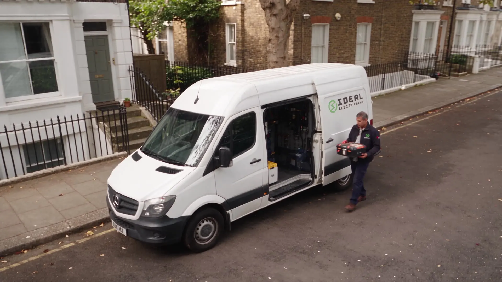 An Ideal Electricians van being loaded on a residential street