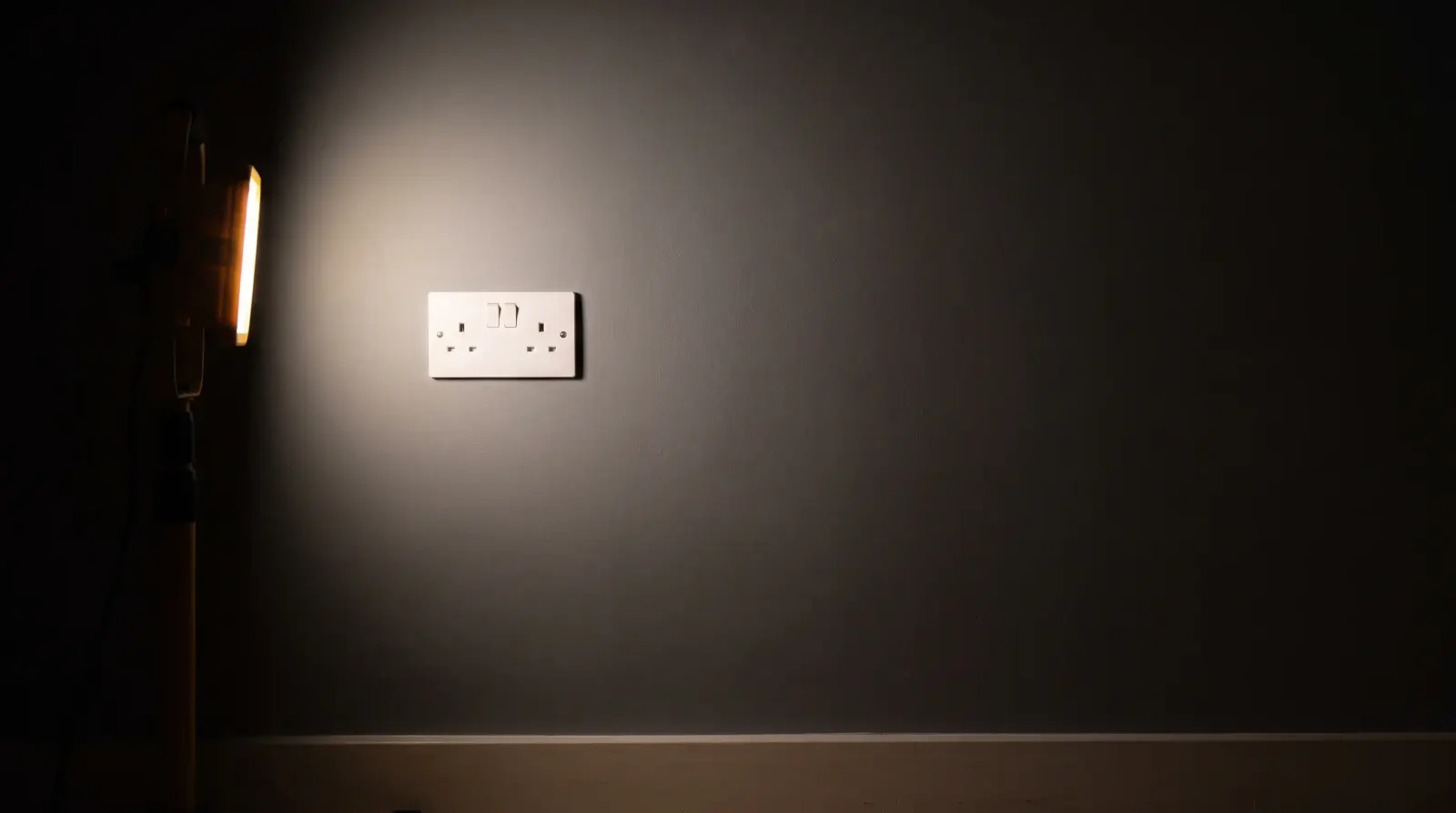 A flush socket and switch plate in a modern flat — new sockets and lighting in Canning Town